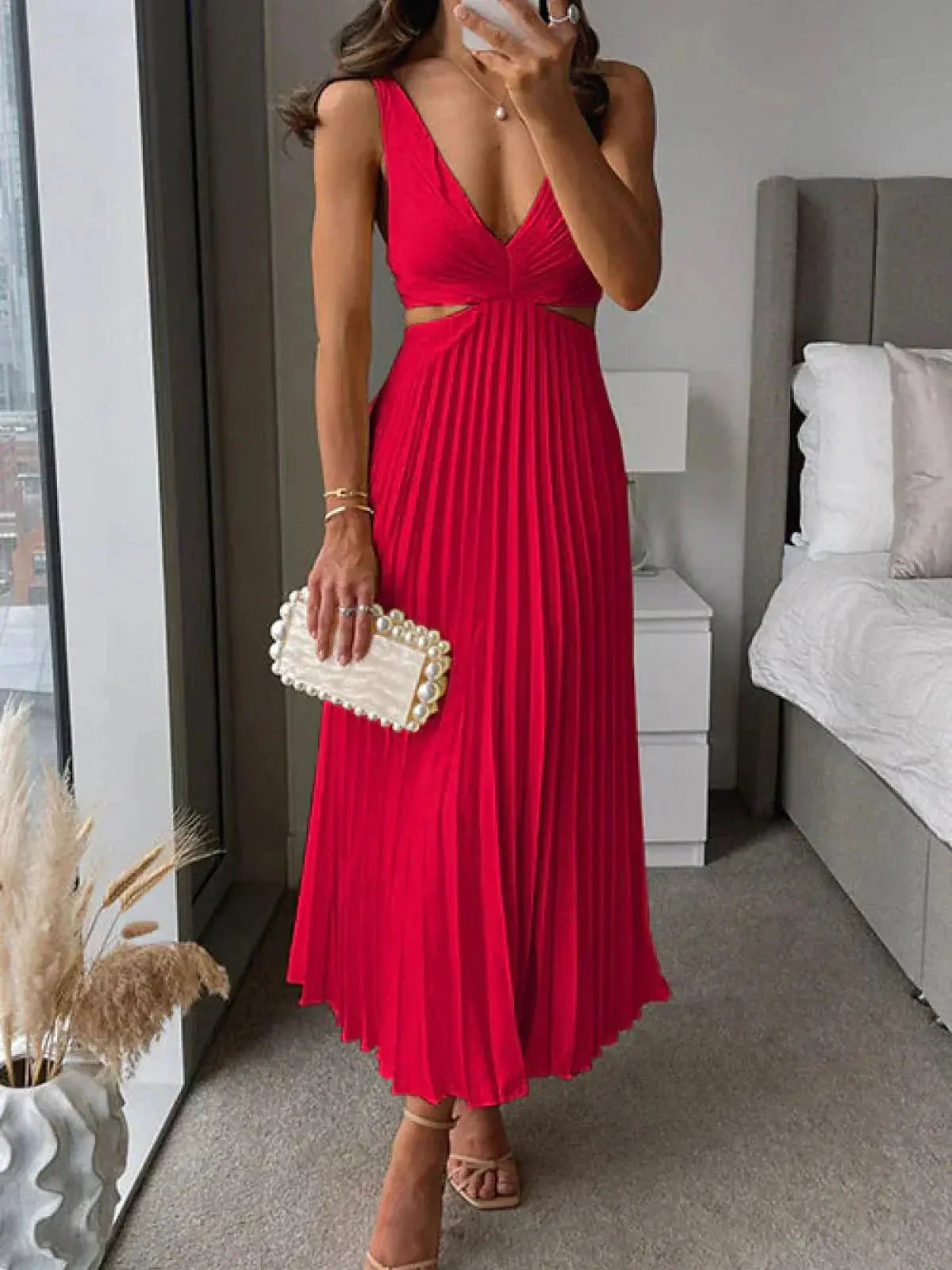 Harrow Grace elegant pleated V-neck midi dress with cutout details, perfect for women attending a wedding as a stylish guest.