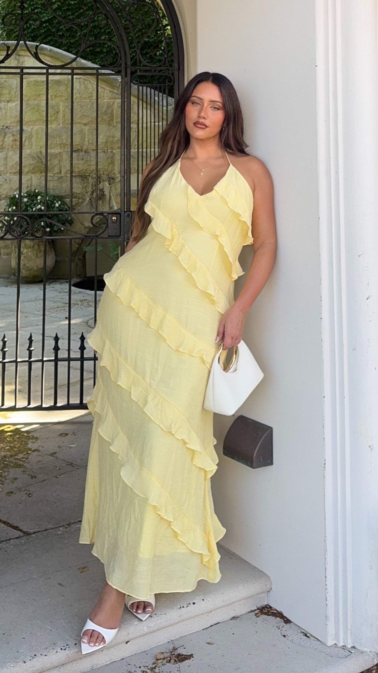 Harrow Greer playful ruffle halter maxi dress for women, perfect for wedding guests, with flowing fabric and stylish ruffle details.