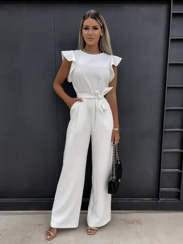Women wearing the Harriet Harrow wedding guest jumpsuit with ruffle sleeves and wide-leg design, suitable for elegant occasions.