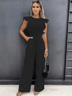 Women wearing the Harriet wide-leg jumpsuit with ruffle sleeves, perfect for wedding guests, by Harrow, showing elegant style and fit.
