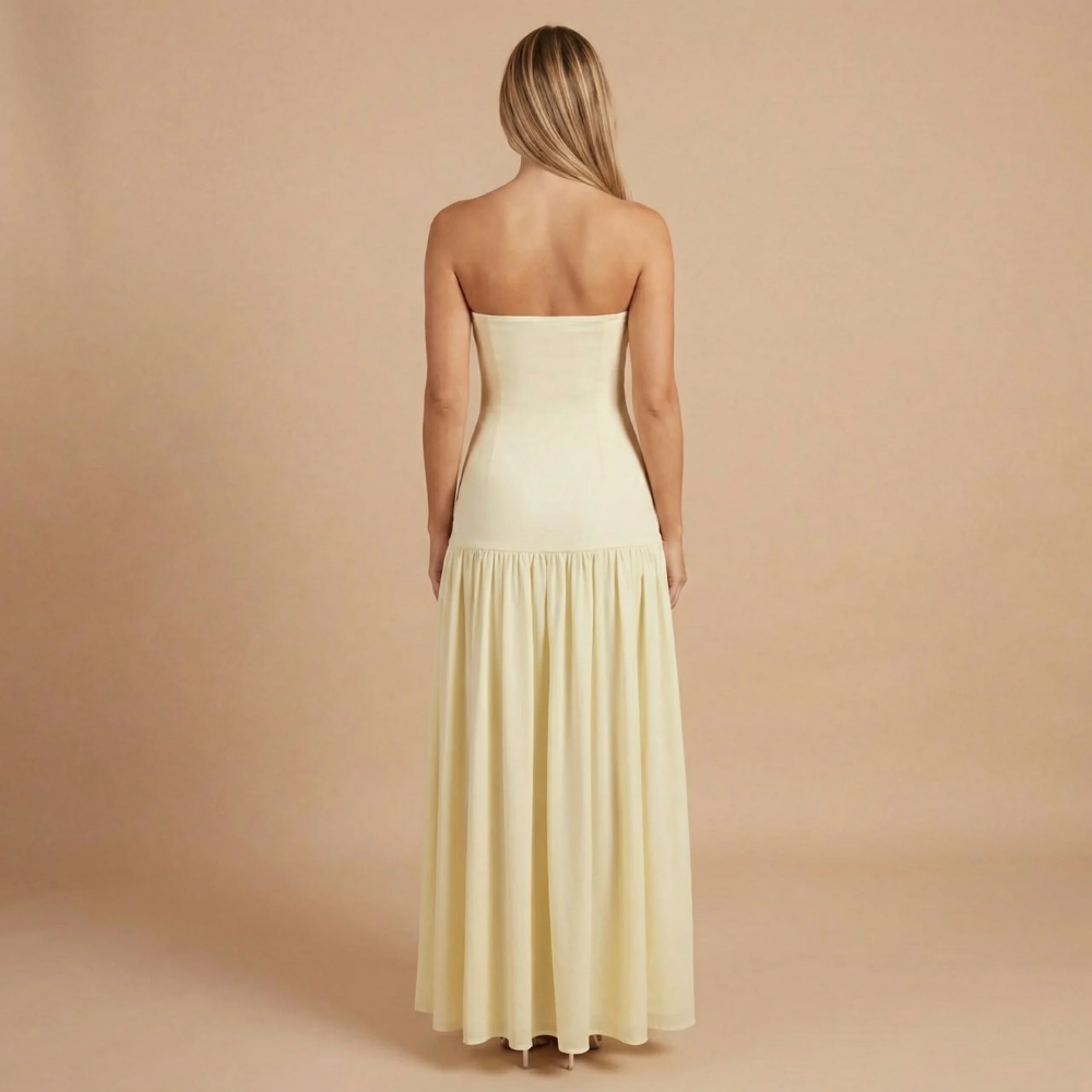 Elegant strapless maxi dress with slit for women, designed by Harrow, perfect for wedding guests.