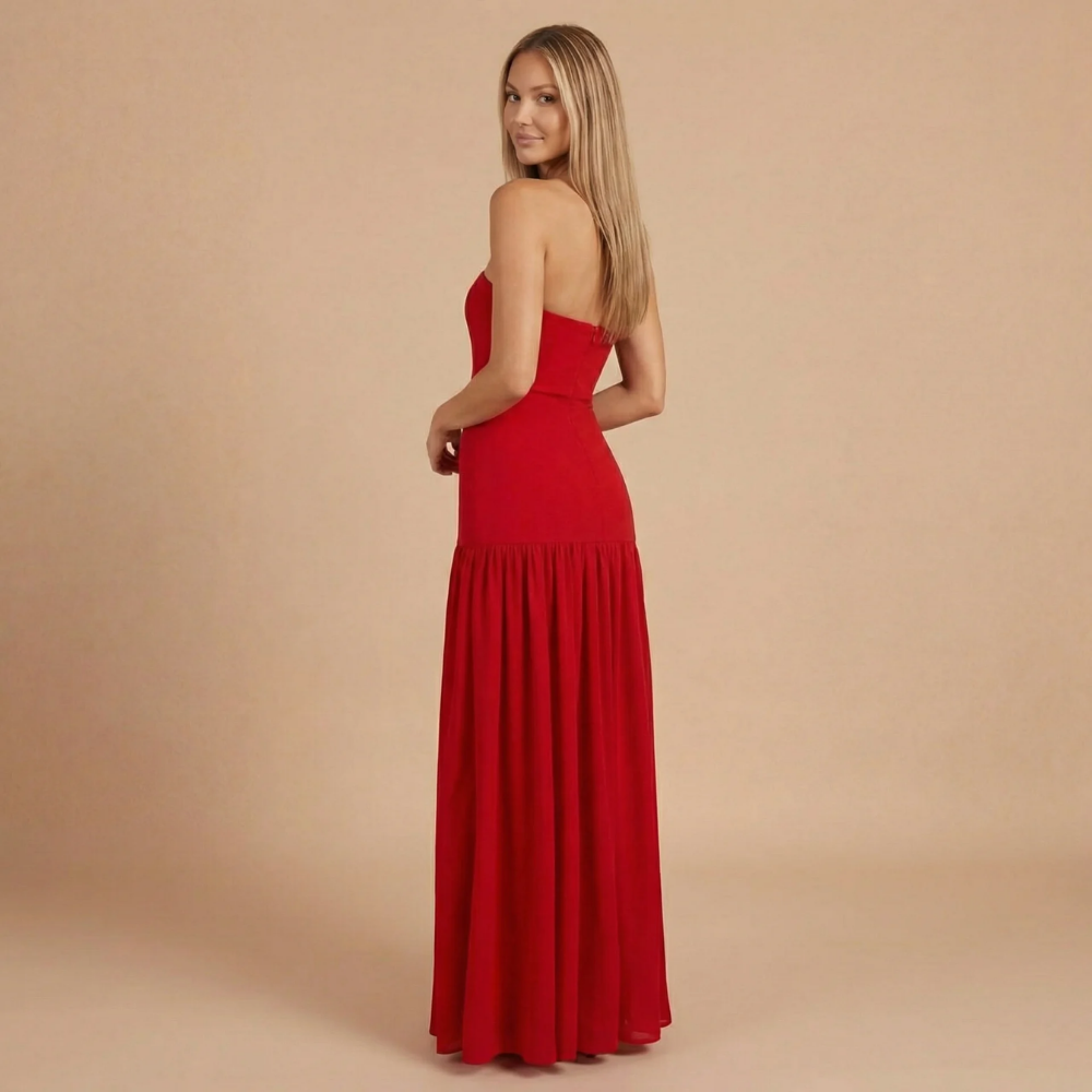 Elegant strapless maxi dress for women, featuring a slit, designed for wedding guests by Harrow.
