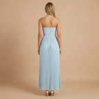 Women wearing the Harrow Ingrid elegant pleated strapless maxi dress, suitable for wedding guests, showcasing flowing fabric and sophisticated style.