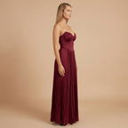 Elegant strapless pleated maxi dress by Harrow, perfect for women attending weddings, featuring flowing fabric and a sophisticated design.