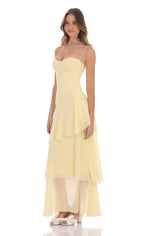 Women wearing the Harrow Irina playful ruffle maxi dress, featuring a sweetheart neckline, suitable for wedding guests.