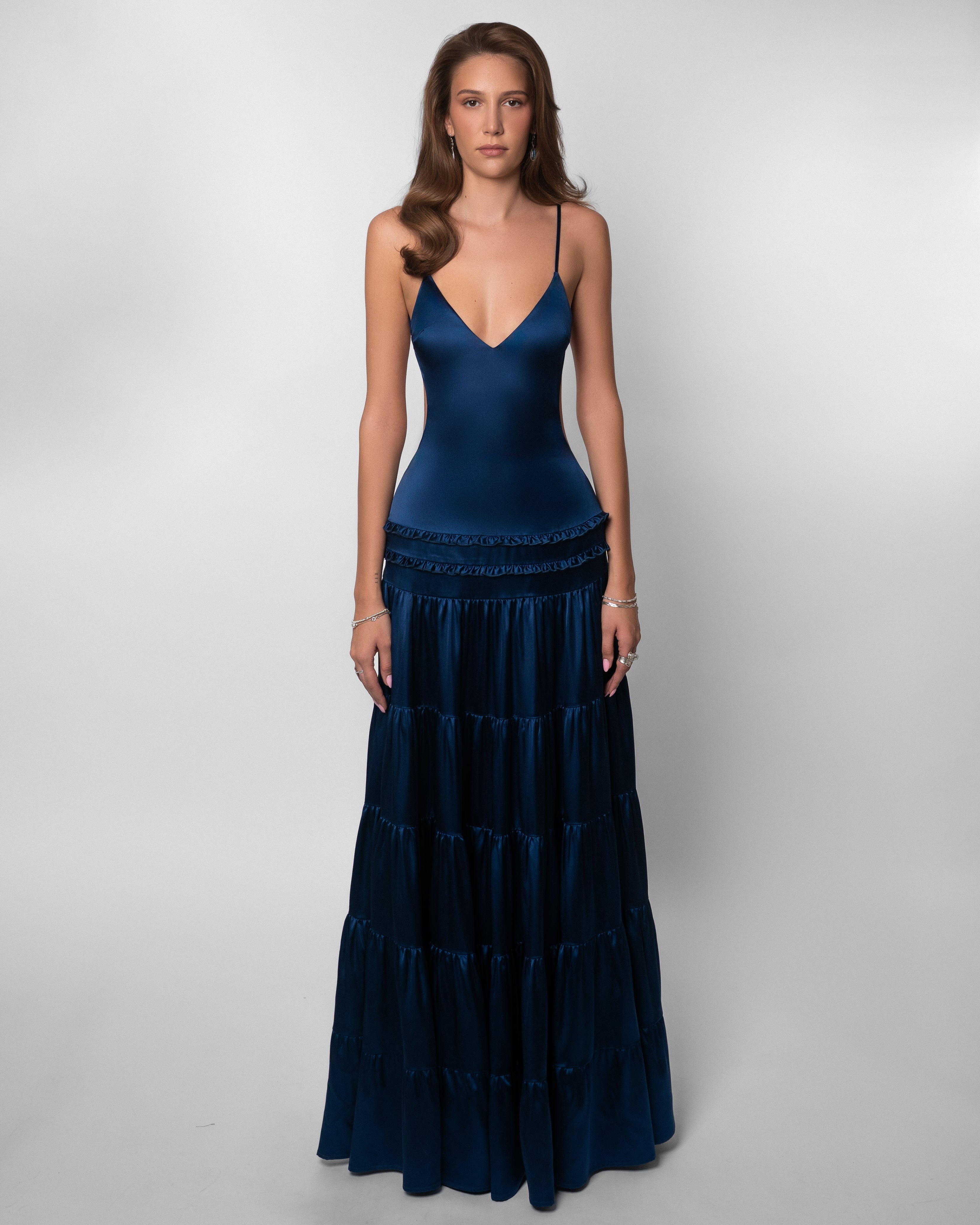 Women wearing the Harrow Isadora V-neck cutout maxi dress, perfect for wedding guest attire, featuring elegant style and flowy fabric.