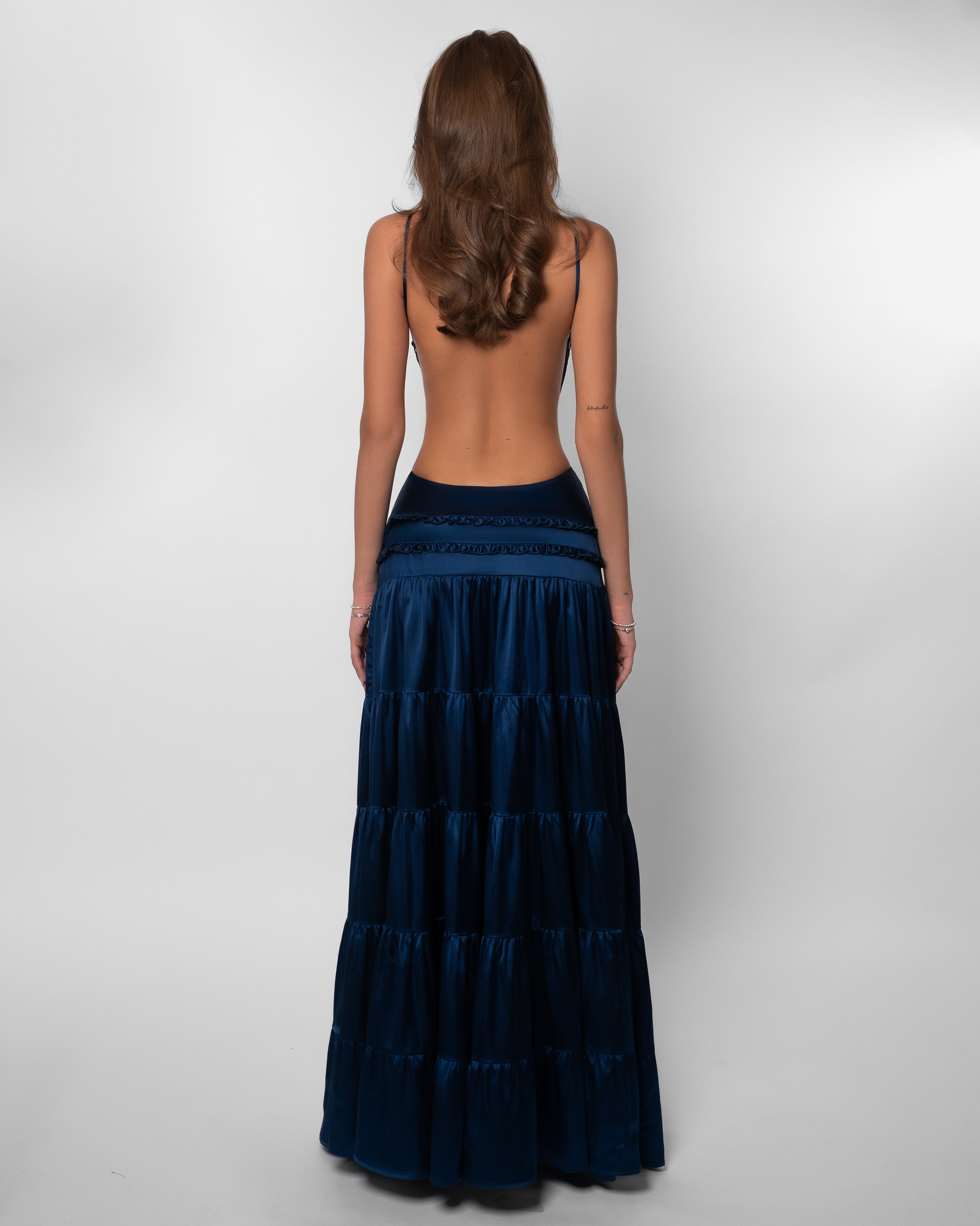 Women wearing the Harrow Isadora V-neck cutout maxi dress, stylish wedding guest attire with elegant design and flowing fabric.