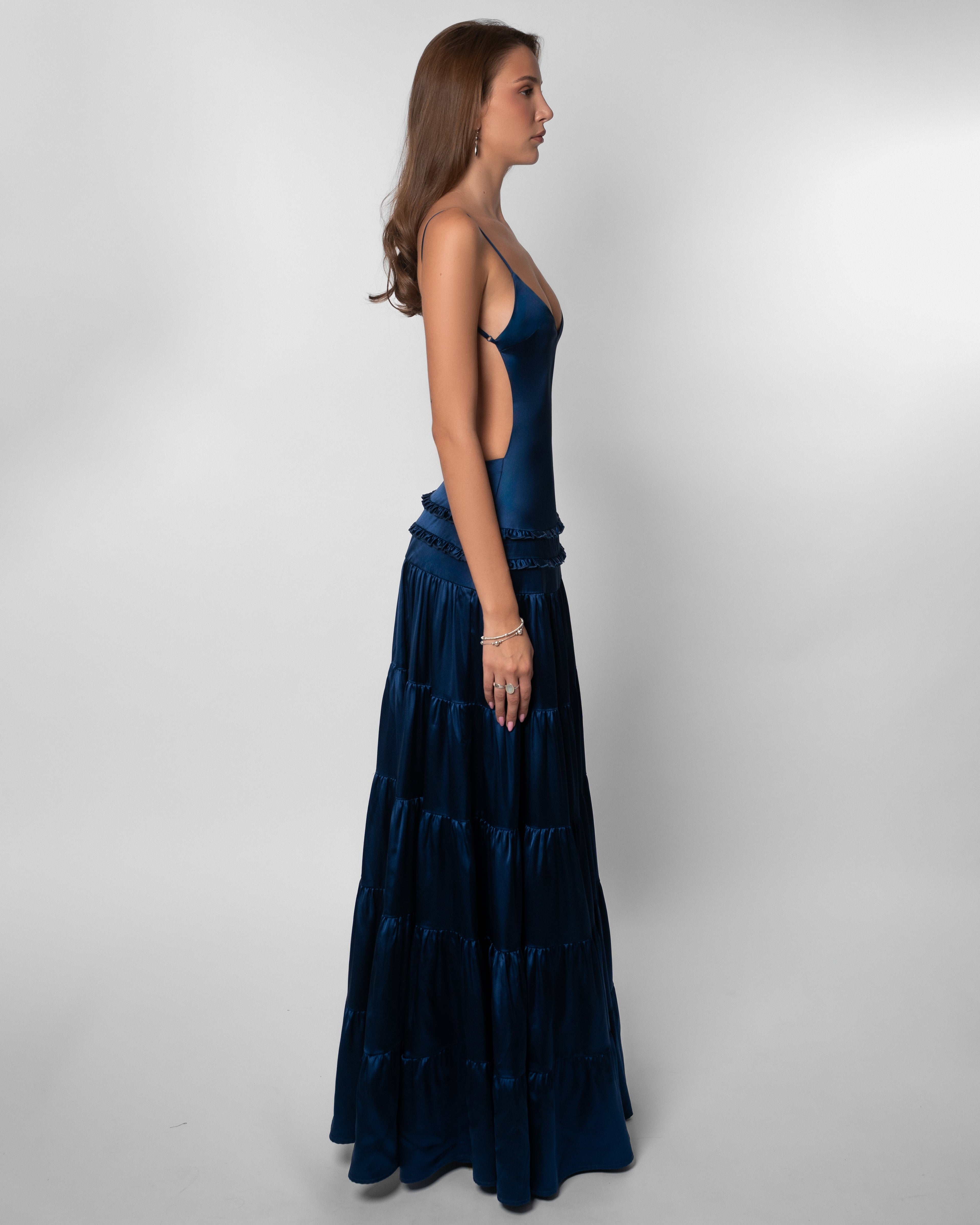 Women wearing the Harrow Isadora V-neck cutout maxi dress, stylish gown for wedding guests, featuring elegant design and flowy fabric.