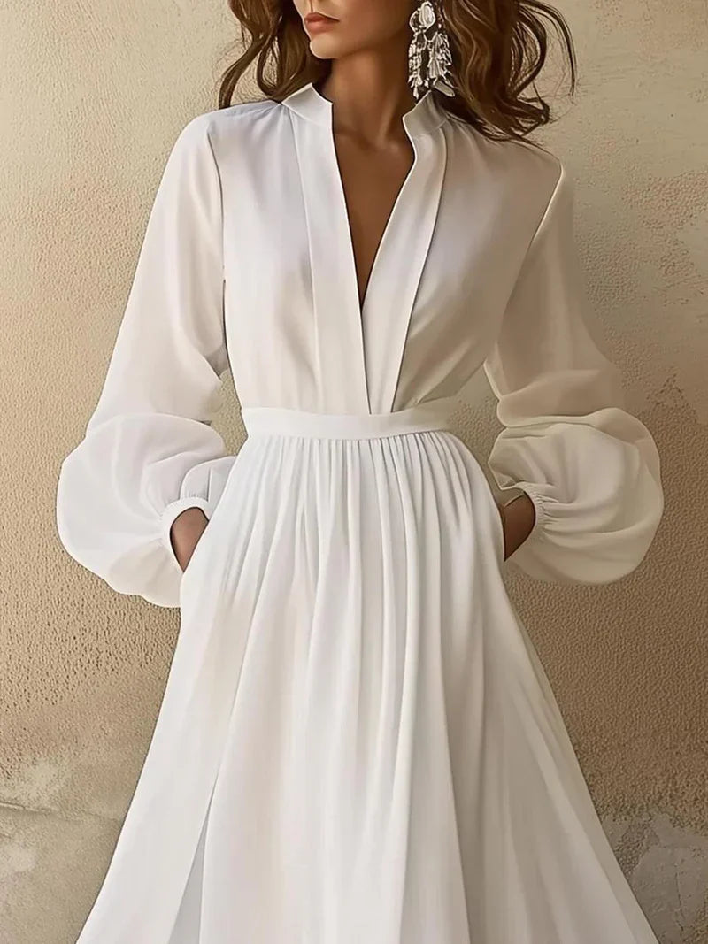 Elegant women's white maxi dress by Harrow with a V-neck, long sleeves, perfect for wedding guests.