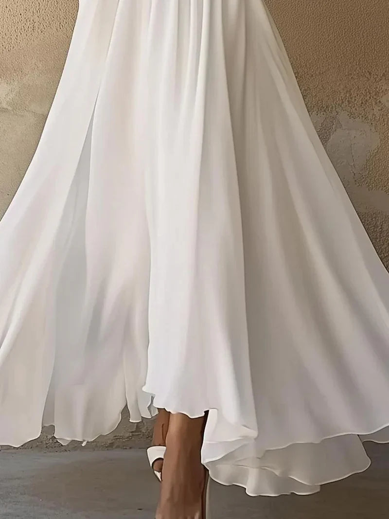 Elegant navy maxi dress for women by Harrow, featuring a V-neck and long sleeves, perfect for wedding guests.