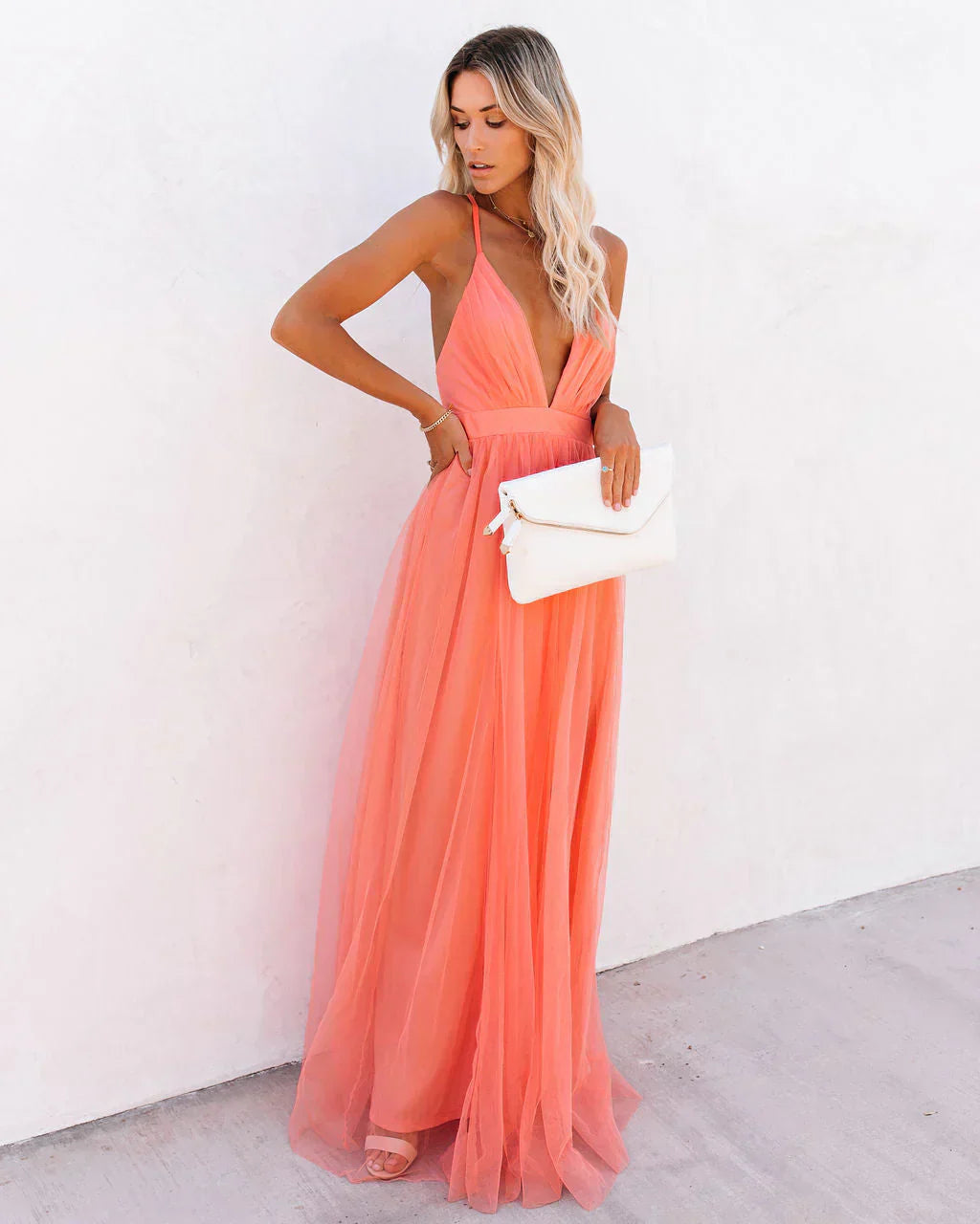 Women wearing the Ivana Harrow elegant V-neck strappy maxi dress, perfect for wedding guest attire.